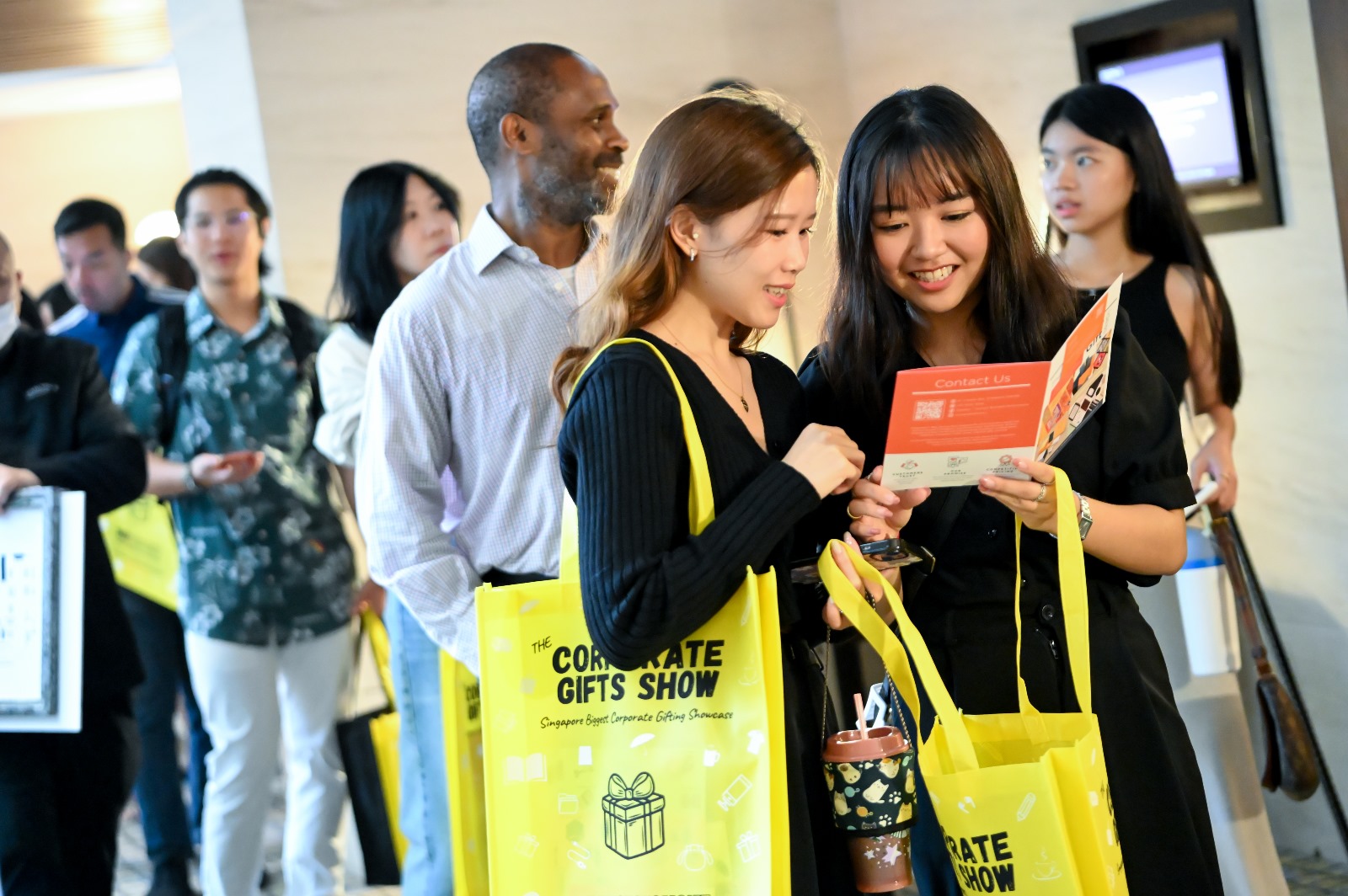 Attendees networking at exhibition booths