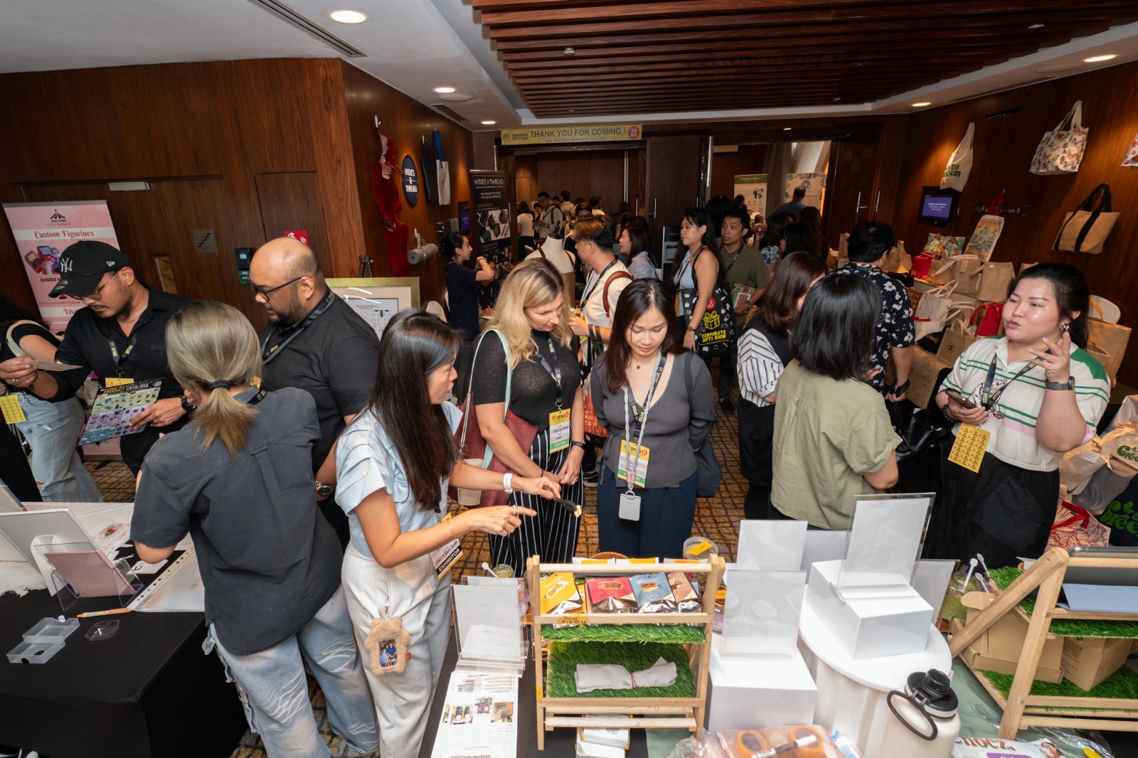 Visitors exploring corporate gift displays